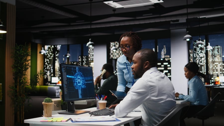 Employees utilizing AI technology for work.