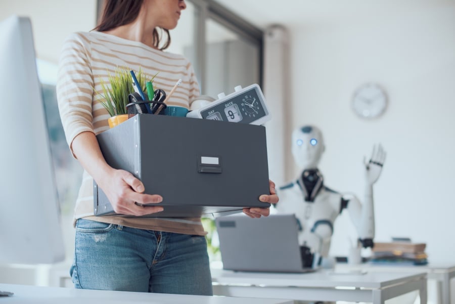 The impact of AI on employment: office worker losing her job.