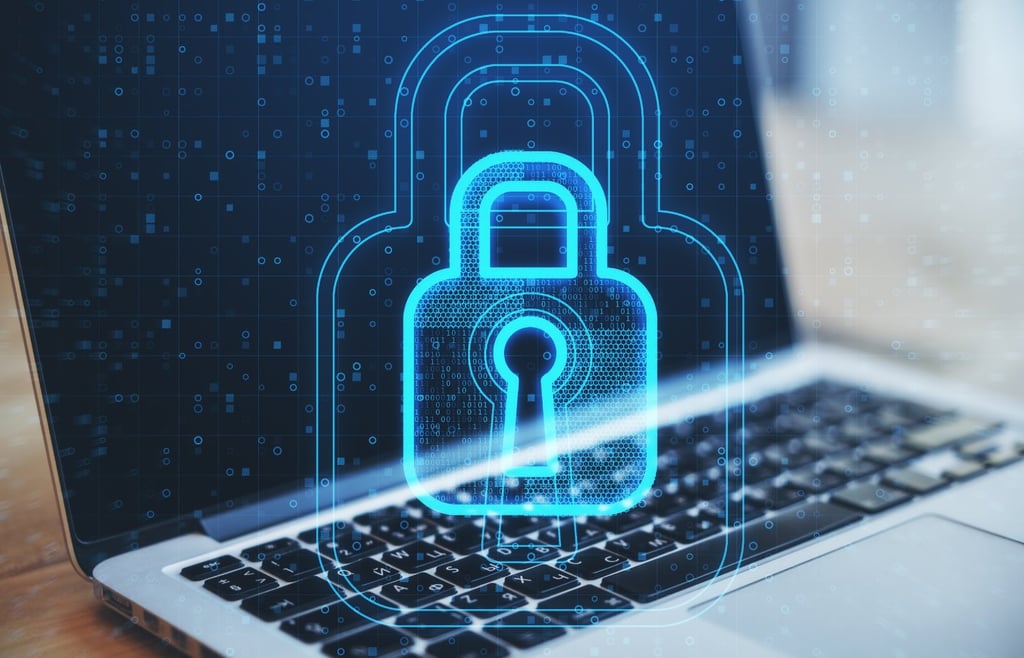Secure digital padlock over a laptop, representing Filing Information Returns Electronically via the IRS IRIS portal.