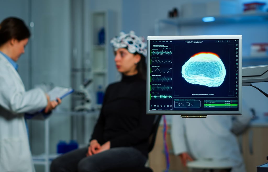 Neurologist scanning a patients brain.