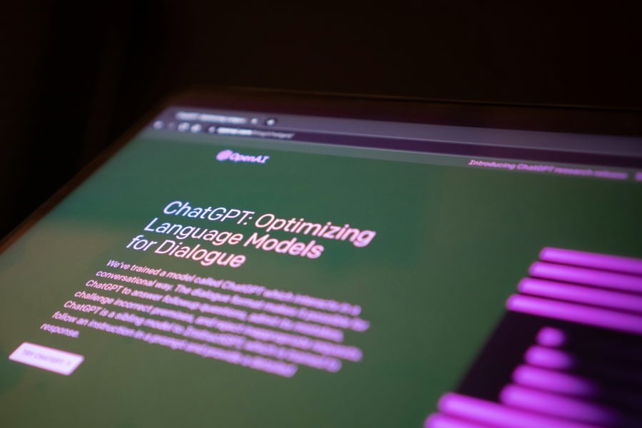 Close up of computer screen with ChatGPT homepage.
