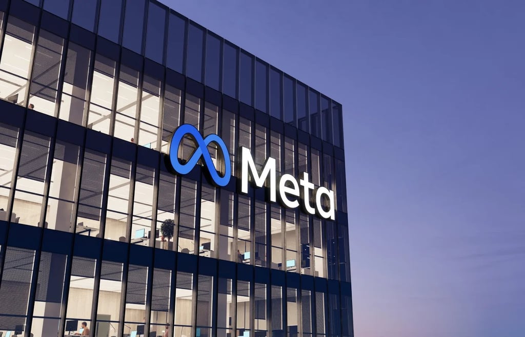 Meta signage on top of glass building.
