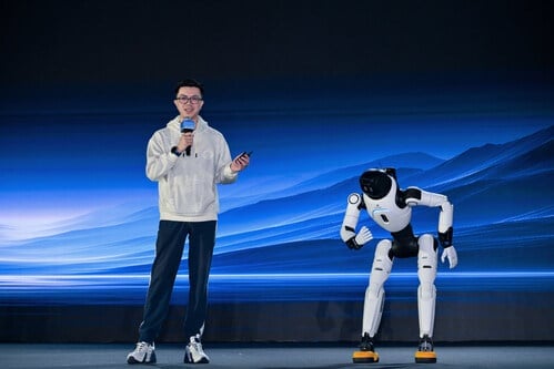 Peng Zhihui, co-founder, president, and CTO of AGIBOT, demonstrates AGIBOT X2's interactive intelligence.