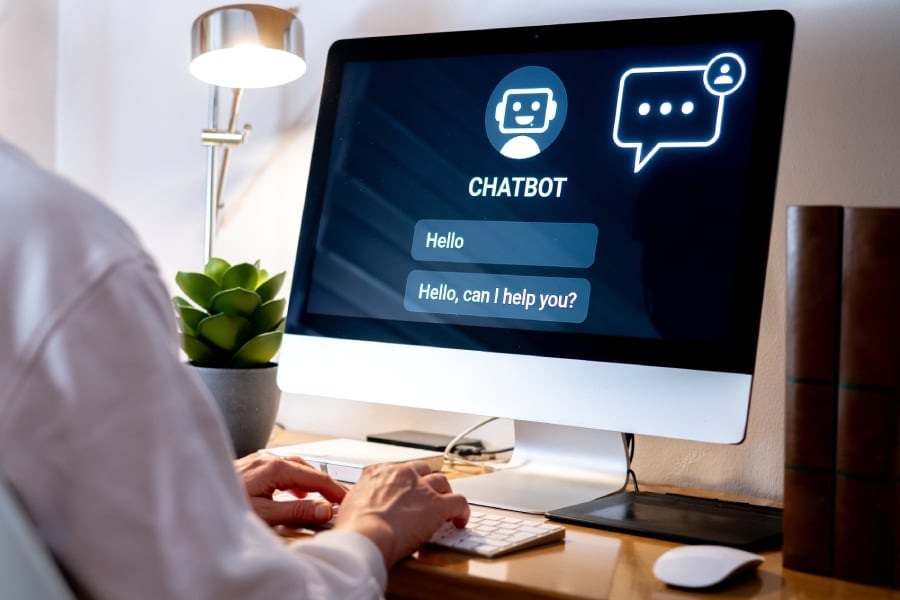 A man using AI chatbot on PC.