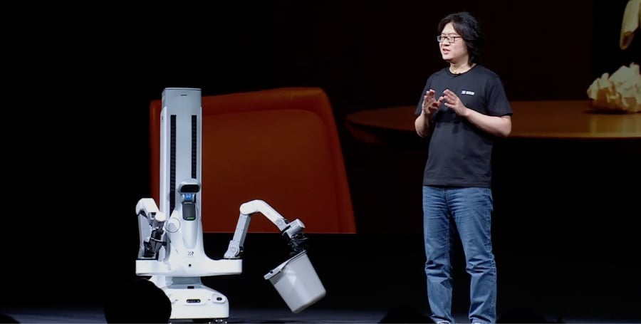 A man demonstrating X Square Robot's abilities on domestic work.