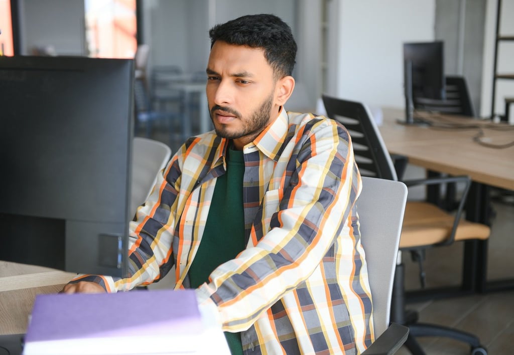 Happy indian male student at the university