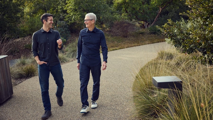 John Ternus and Tim Cook having a conversation.