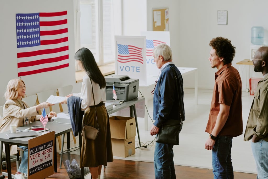 High angle view of diverse young and mature citizens standing in line to get ballot papers at voting station on election day.