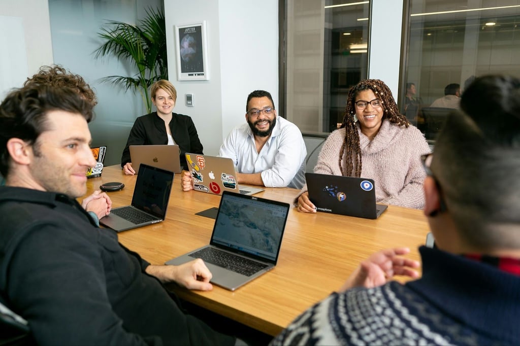 A group of office workers conducting a meeting.