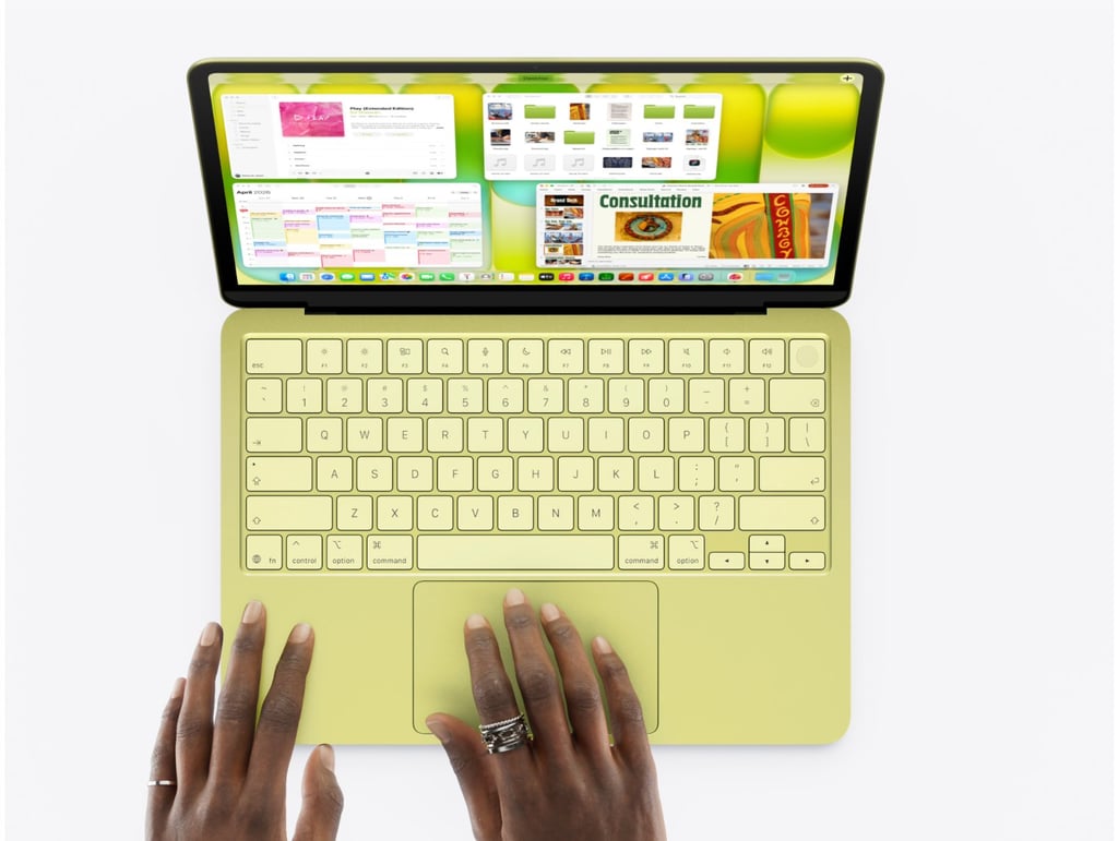 Hands typing on a macbook Neo.