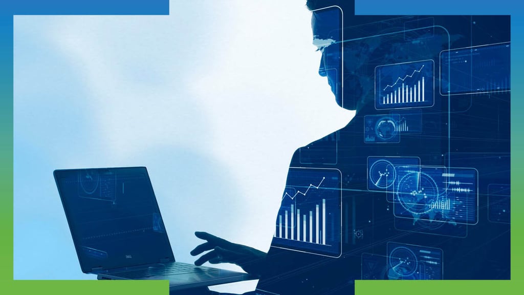 Silhouette of person typing on laptop with overlay of financial charts