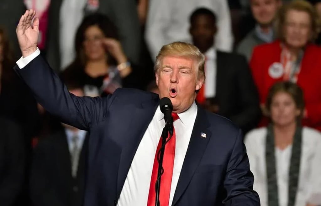 President Donald J. Trump speaking in front of an audience.