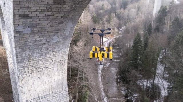 AITHON Robotics features a flying drown hovering beneath a bridge.