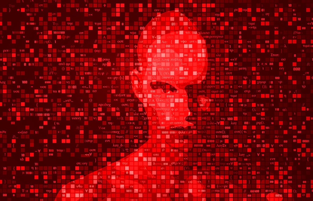Silhouette of a man hidden in programming code.