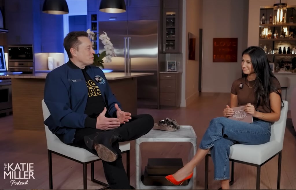 Elon Musk in a United States Air Force Academy jacket and Katie Miller sit for an interview on her podcast."