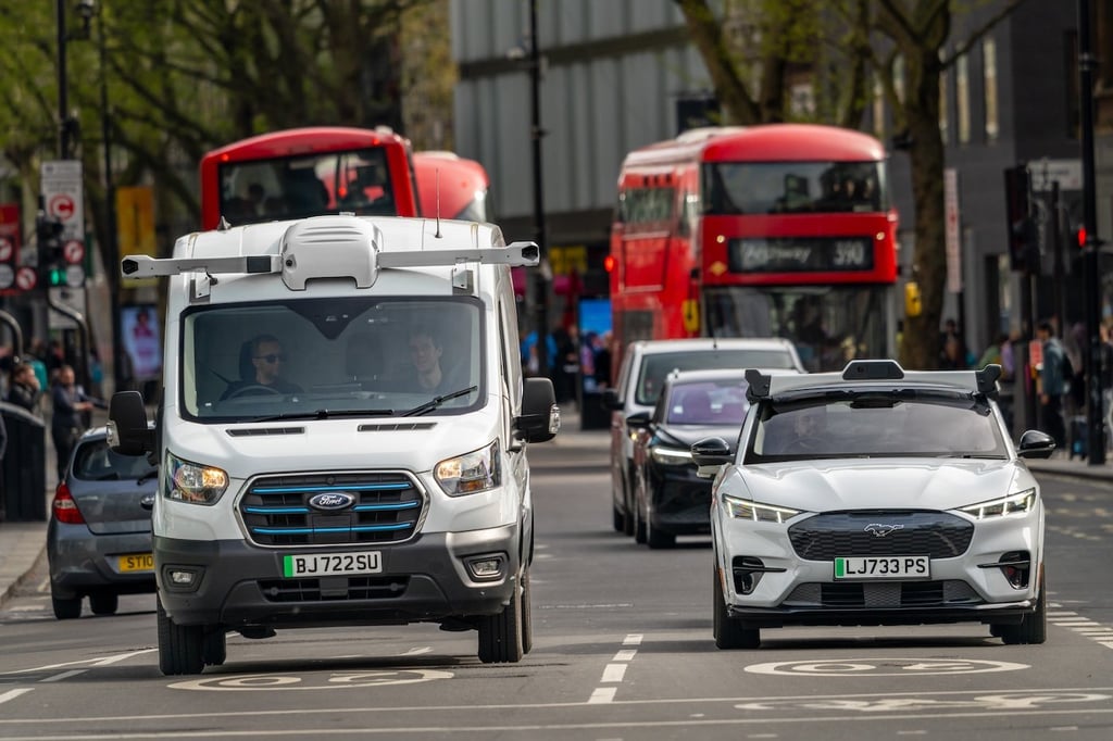 Wayve autonomous vehicles navigate a city street.