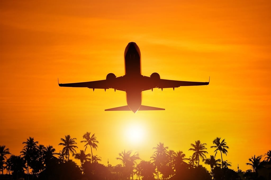 Airplane with sunset in the background