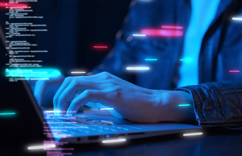 IT professional working on a laptop with floating virtual blocks of code.