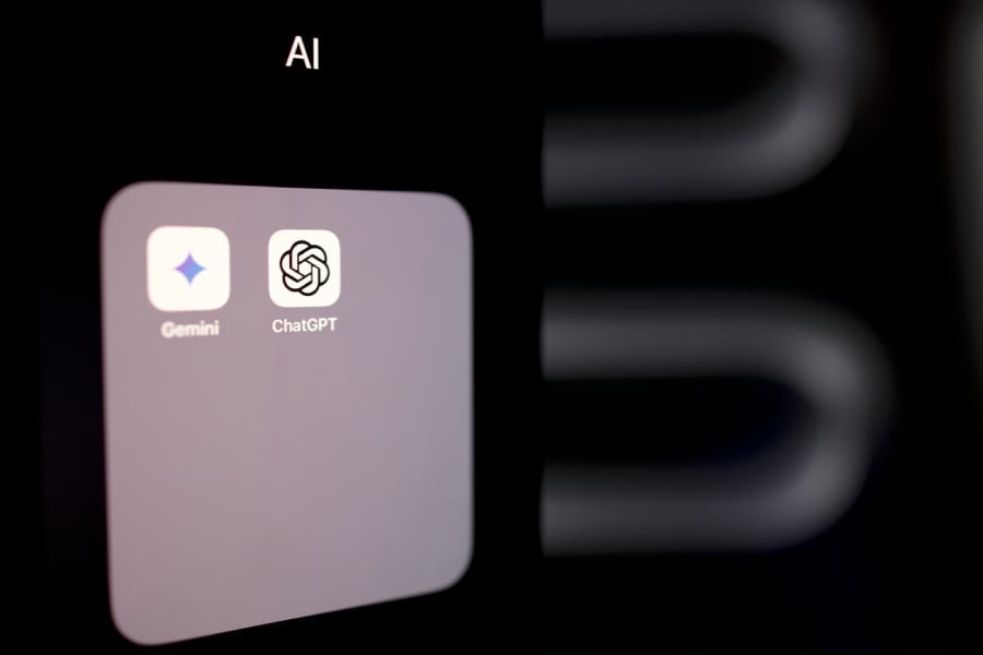 A smartphone with Google Gemini and ChatGPT apps installed.