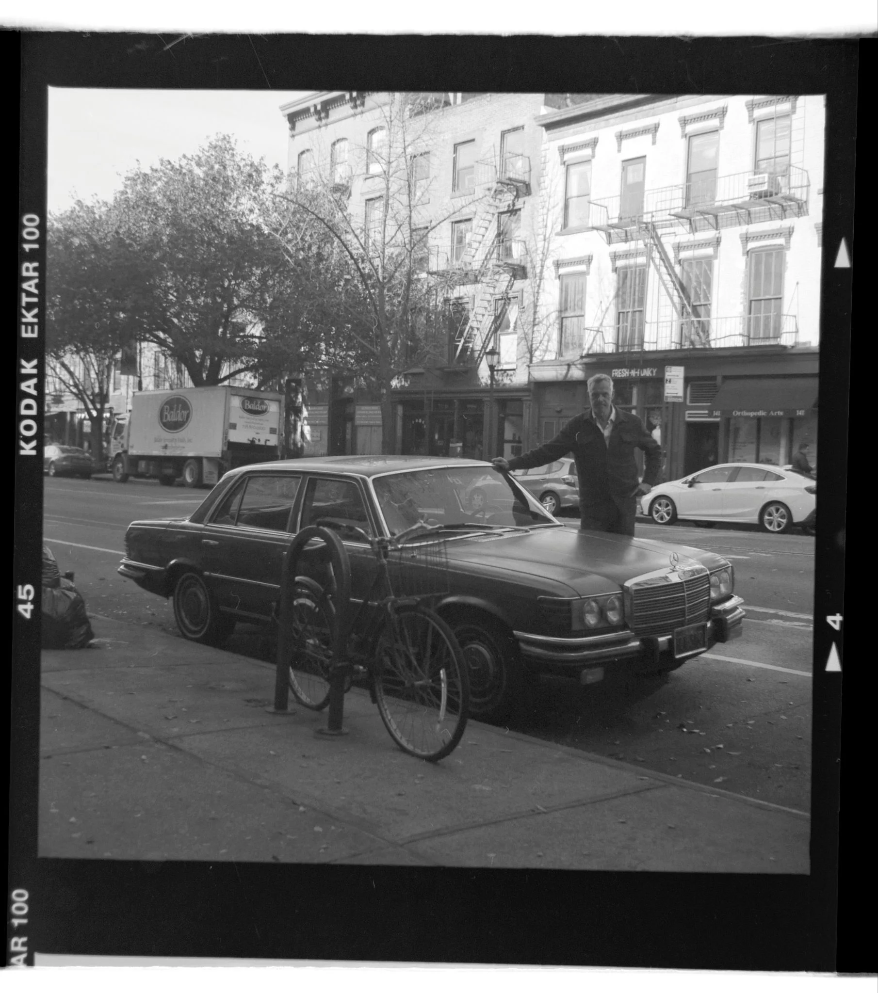 Original photo of a man and his car.